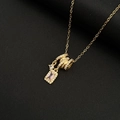 Golden fringe necklace with square pink gemstone and pavé zircon spiral pendant - Gold Tassel Cube Necklace