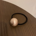 Minimalist black elastic hair tie featuring a rose gold brushed metallic bead ornament - Rose Gold