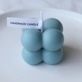 Blue bubble cube handmade scented candle with white small tag on a ceramic plate - Ultramarine (Teakwood)