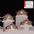 Red Christmas house music box with warm LED lighting and miniature snowman scene - Warm Red Christmas Cottage Light Style (2252)