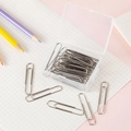 Silver metal paper clips in a clear PP storage box for office and school document binding - Silver