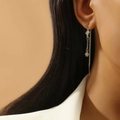 Long silver tassel earrings with double star-shaped diamond charms on a female model - Double Star Shape Style
