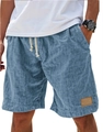 Detail of blue linen-textured shorts featuring a drawstring waist and decorative leather tag - Blue