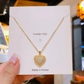 Elegante collana in titanio dorato con ciondolo a cuore decorato con cristalli lucidi - Oro Cuore