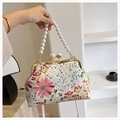Detail of floral embroidery and pearl bead handle on pink vintage evening handbag - Pink