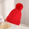 Red cable knit beanie with faux fur pompom and wide ribbed cuff for winter warmth - Red
