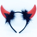 Detailed view of red glitter devil horns with black feather trim on a sleek headband - Red Glitter Horns + Black Feather + Black Headband