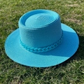Close-up of bright blue wide brim straw hat with matching chain detail on green lawn - M (56-58cm) / Lake Blue