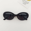 Classic black oval kids sunglasses with UV protection in a vintage minimalist style - Black