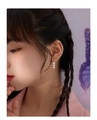 Silver triple heart drop earrings in minimalist style worn by a female model - Heart Tassel Hooks