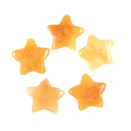 Macro detail of five polished yellow-orange crystal star ornaments in a circular layout - Topaz