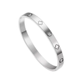 Detail view of silver stainless steel bangle with clover motifs and zircon stones - Silver