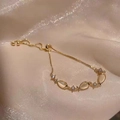 Golden cat eye stone bracelet with adjustable slider and pavé cubic zirconia details - S129 Gold