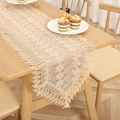 Detailed view of elegant beige lace table runner featuring delicate hollow embroidery. - Style 6