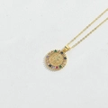Gold St. Benedict pendant necklace with multi-color zircon stones on white background - Sun Shape Virgin Mary