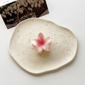 Pink gradient plumeria hair claw clip with glossy finish on a decorative ceramic tray - Small / Gradient Pink White