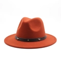 Detail of rust red wool fedora hat featuring a leather band with silver star studs - Brick Red