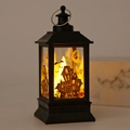 Close-up of black Halloween lantern with haunted house silhouette and warm LED light - Castle