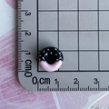 Detailed view of a 1cm mini black and pink doughnut resin charm measured with a ruler - 07-Black Top Pink Bottom Donut