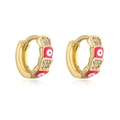 Detail of gold hoops with red enamel evil eyes and shimmering zircon stones - Red
