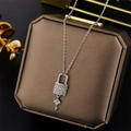 Sparkling silver key and lock necklace with pavé crystals on a premium display box - Key Lock / Silver