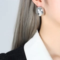 Minimalist silver dome stud earrings with high-polish mirror finish on a model - Silver (Mirror Polish)