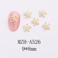 Detail view of 9x8mm gold hollow star flower nail charms for DIY manicure art - Hollow Flower (A526)