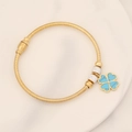 Detail of gold snake chain bracelet featuring a blue clover charm and sparkling crystals - Turquoise Four-leaf Clover (7#)