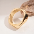 Detailed view of wide irregular twisted golden metal bracelet with mirror finish - Irregular Twisted Gold Style