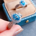 Elegant silver ring featuring an oval blue center stone and a sparkling diamond halo - Aquamarine Diamond [white Gold] Ljz-106 / Adjustable Open