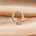 Detail view of 8mm silver hoop earring on silk background with snap closure - 1PC / 8mm / Silver