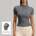Top sportivo da donna grigio sale marino, vestibilità slim con zip e collo alla coreana - Grigio Roccia Marina