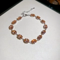 Elegant silver bracelet with oval-cut orange zircons and lobster clasp closure - Silver-Coffee
