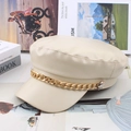 Detail of cream PU leather newsboy cap featuring a decorative gold metal chain on top - One Size 58cm / Beige Gold Ring Chain Style