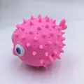 Pink pufferfish squeeze toy made of soft silicone for kids bath and stress relief fun - Pink Bath Dolphin