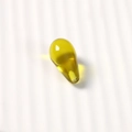 Macro shot of yellow-green transparent teardrop resin beads with smooth glossy finish - 1 Piece / Brown