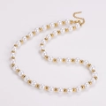Detail of elegant pearl and gold bead necklace with an adjustable extender chain - Gold Color Necklace (8mm)