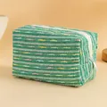 Green and white floral quilted makeup bag with colorful speckled woven texture - Light Green with Colorful Lines