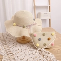 Detail of straw hat and bag set with colorful pom-poms and delicate wavy crochet edges - Beige Hat + Bag