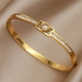 Elegant gold titanium heart bracelet with sparkling zircon stones on silk background - White Heart with Pavé Stones