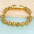 Polished gold 8mm bead chain bracelet with magnetic clasp on a dual-tone background - Gold