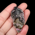 Natural pink rhodonite leaf pendant with hand-carved veins and unique black textures - Rhodonite