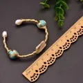 Handmade gold wire wrap bracelet featuring baroque pearls and turquoise stones - Turquoise Baroque Pearl Style
