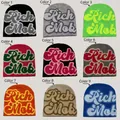 Rich Mob letter jacquard knit beanies shown in nine assorted streetwear colorways - 102