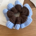 Detail of blue and brown knitted scrunchie showing soft textured wool and pleated design - Hair Tie / Blue & Coffee