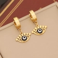 Macro shot of gold evil eye earrings with star cutouts on a beige jewelry box - Star Hollow Eye (9#)