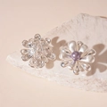 Detailed view of silver flower earrings with magenta pearl center on a stone texture - Silver Flower Grey Pearl (Silver Pin)
