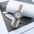 Rose gold mermaid style quartz watch with leaf bracelet and crystals on white stand - Rose Gold