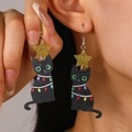 Close-up of a festive Christmas cat earring with gold glitter star and colorful lights - Star Hook Dangle