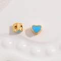 Macro shot of light blue enamel heart bead with gold edges for DIY jewelry making - Gold Plated Blue Enamel Heart Bead